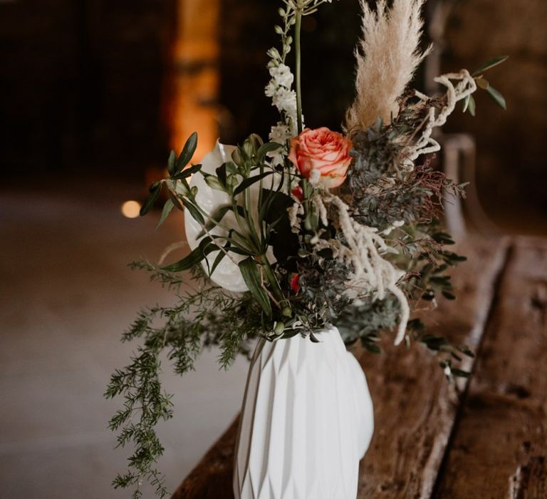 Wedding flowers in white vase