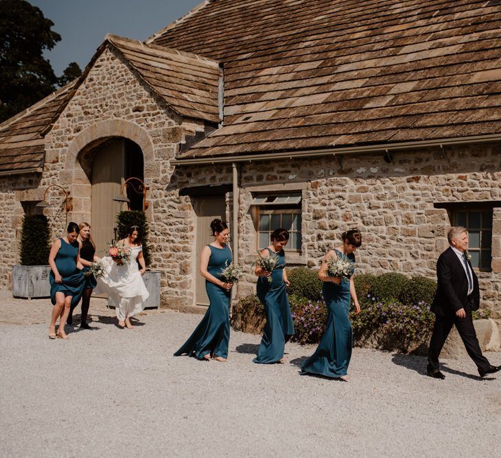 Bridesmaids walking to the Tithe Barn Bolton Abbey wedding ceremony