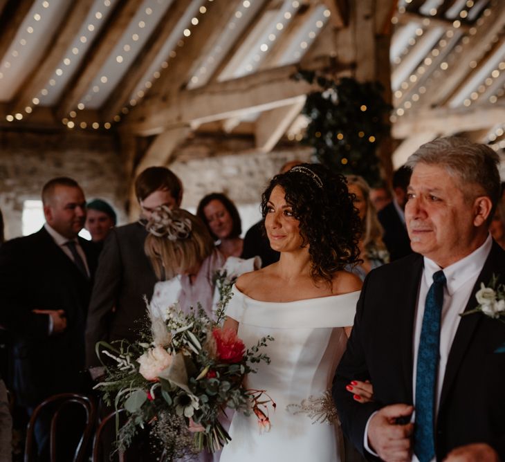 Father of the bride walking his daughter down the aisle