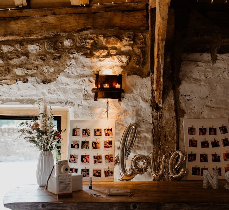 Wedding decor at Tithe Barn Bolton Abbey with foil balloon