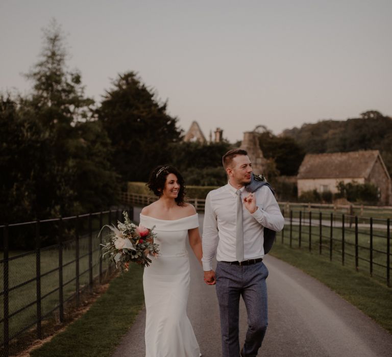 Bride and groom portrait on the grounds of Bride and Groom portrait at Tithe Barn, Bolton Abbey