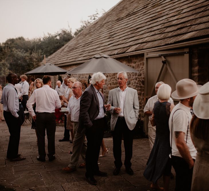 Wedding guests outside Tithe Barn, Bolton Abbey wedding venue