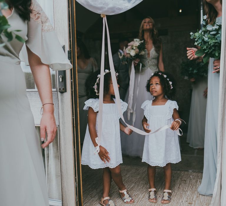 Flower Girls In White Dresses With Balloons // Image By Ross Talling Photography