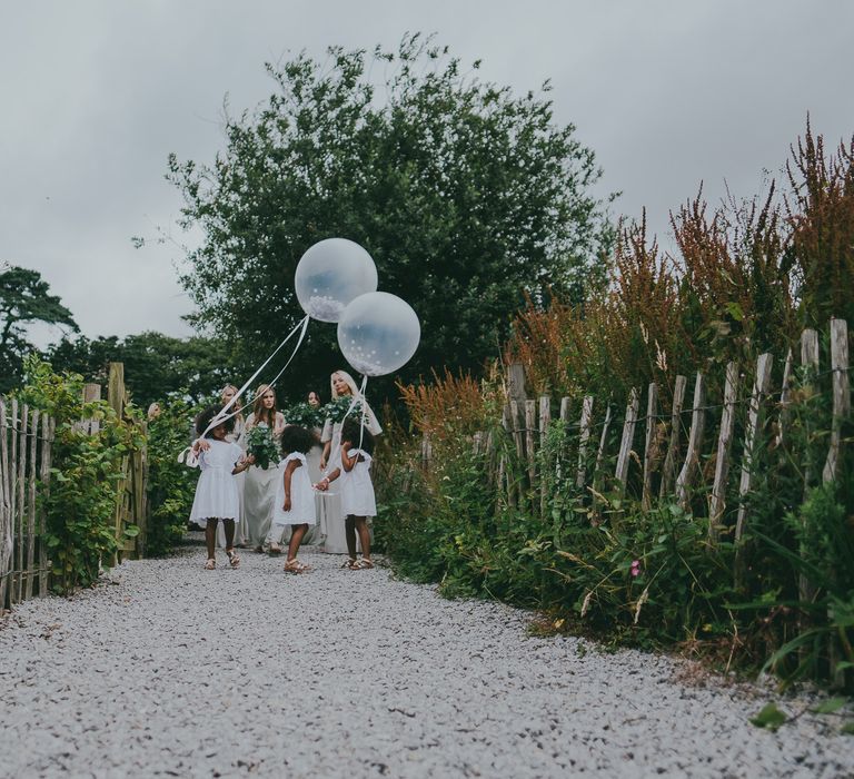 Flower Girls In White Dresses With Balloons // Image By Ross Talling Photography