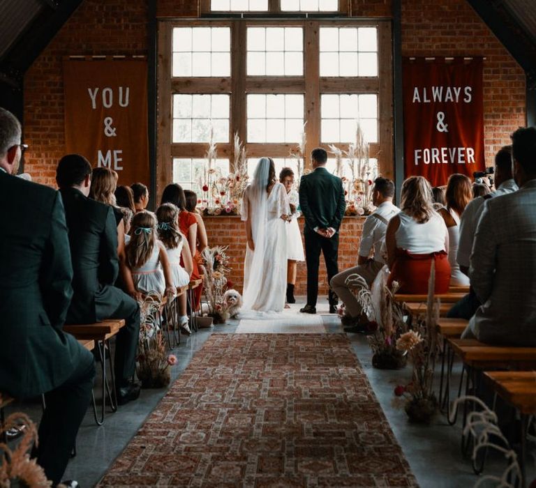 Wedding ceremony at The Giraffe Shed with Autumn wedding colours