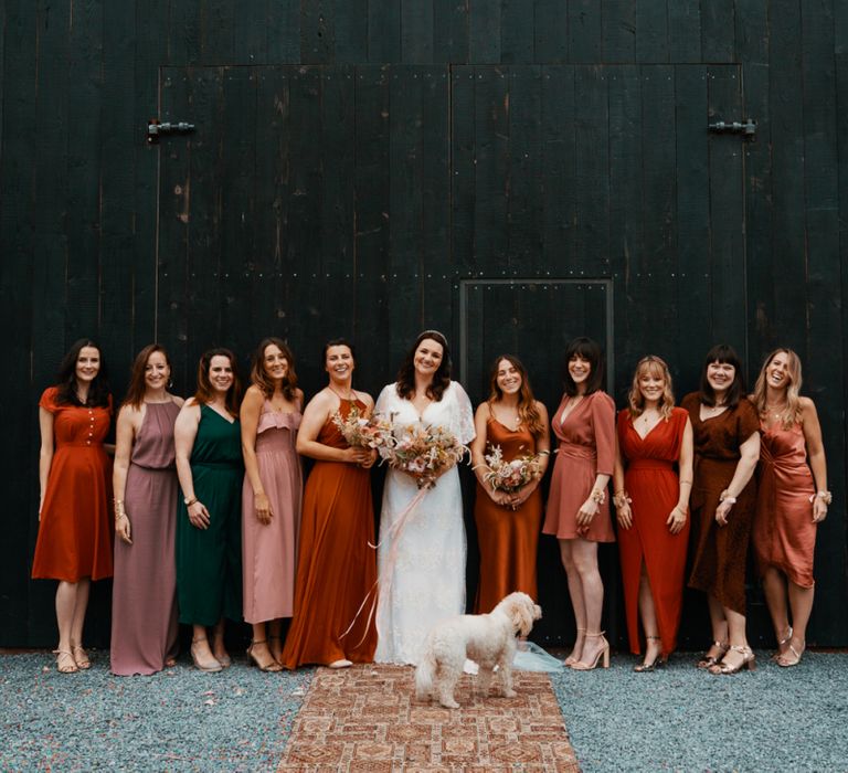 Bride with bridesmaids in Autumn wedding colours dresses