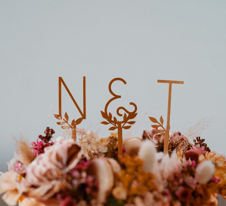 Personalised cake topper with dried flowers