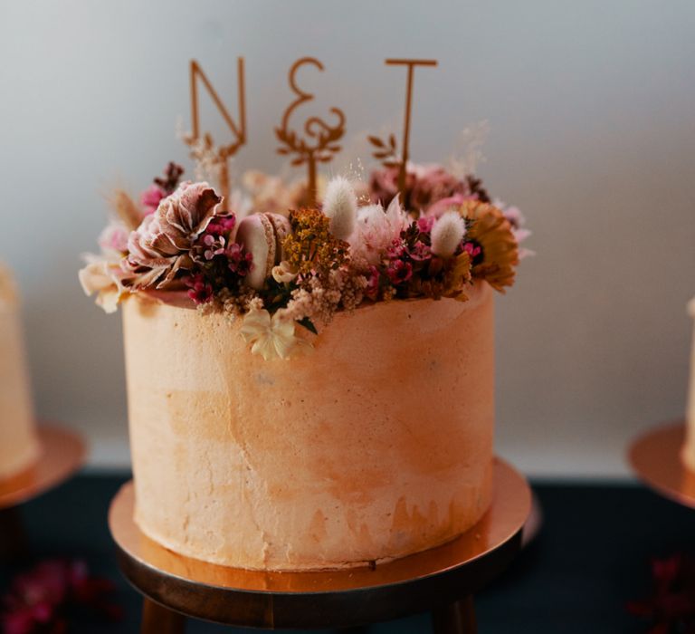 Wedding cake in Autumn wedding colours with dried flower topper