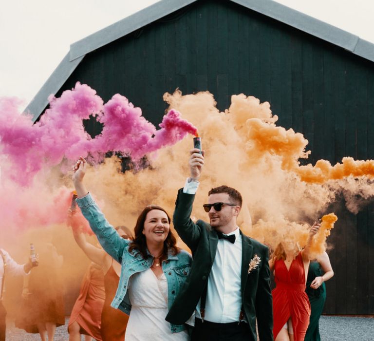 Bridal jacket with smoke bombs in Autumn wedding colours