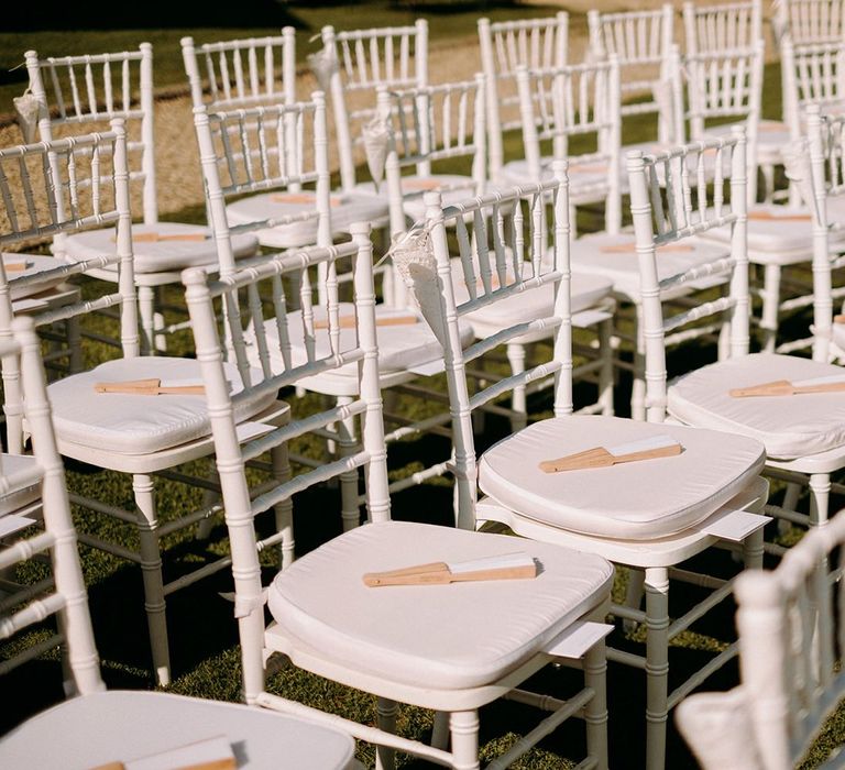 Outdoor wedding ceremony in Florence with fans for guests