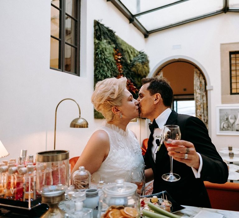 Bride and groom enjoy a drink after ceremony