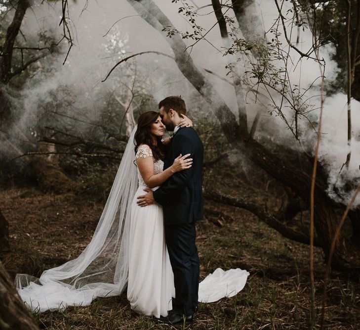 Smoke Bomb Wedding Portrait of Bride and Groom wearing Limor Rosen Wedding Dress