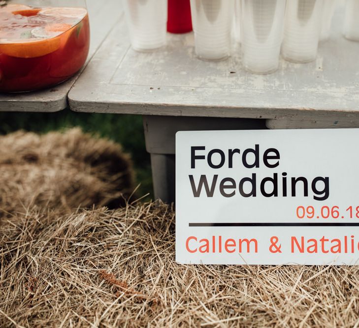 Wedding Sign // Caribbean Influenced Wedding Kingsthorpe Lodge Barn With Steel Band And Bride In Maggie Sottero Images From Ania Ames Photography