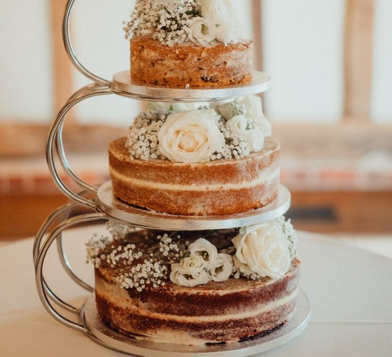 Naked wedding cake with flower decoration