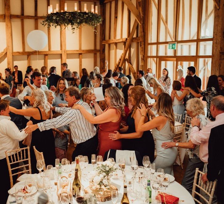 Guests enjoy entertainment at Micklefield Hall wedding venue