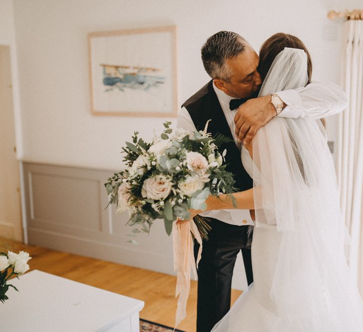 Father sees bride for first time in her dress