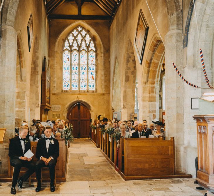 Groom waits for bride at church ceremony