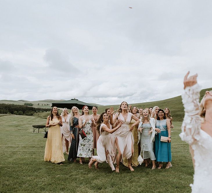 Bride Throws Bouquet to Wedding Party