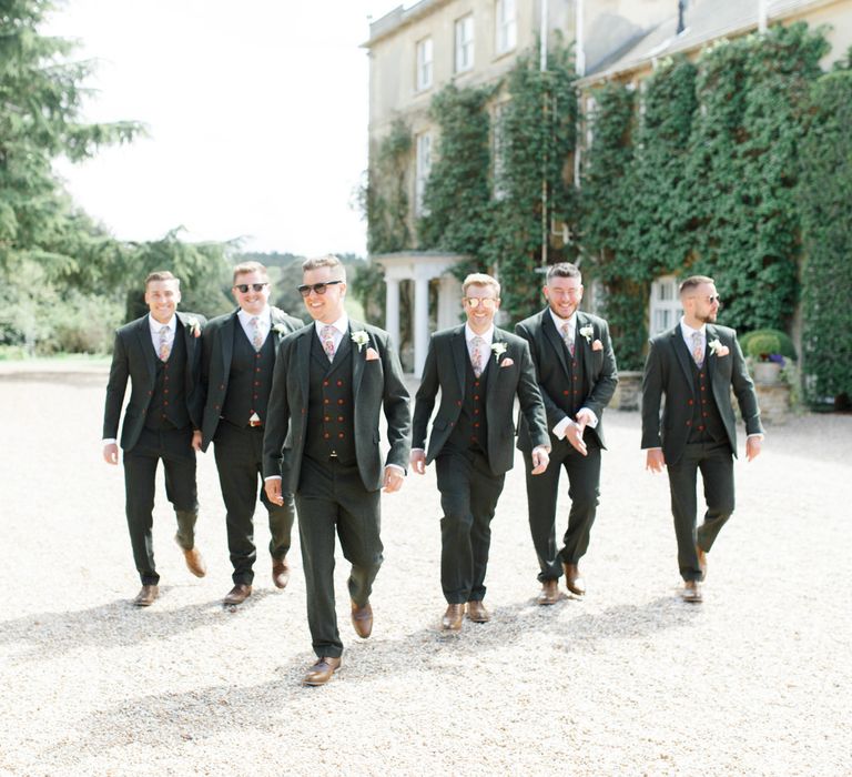 Groomsmen in Matching Grey Suits with Red Buttons