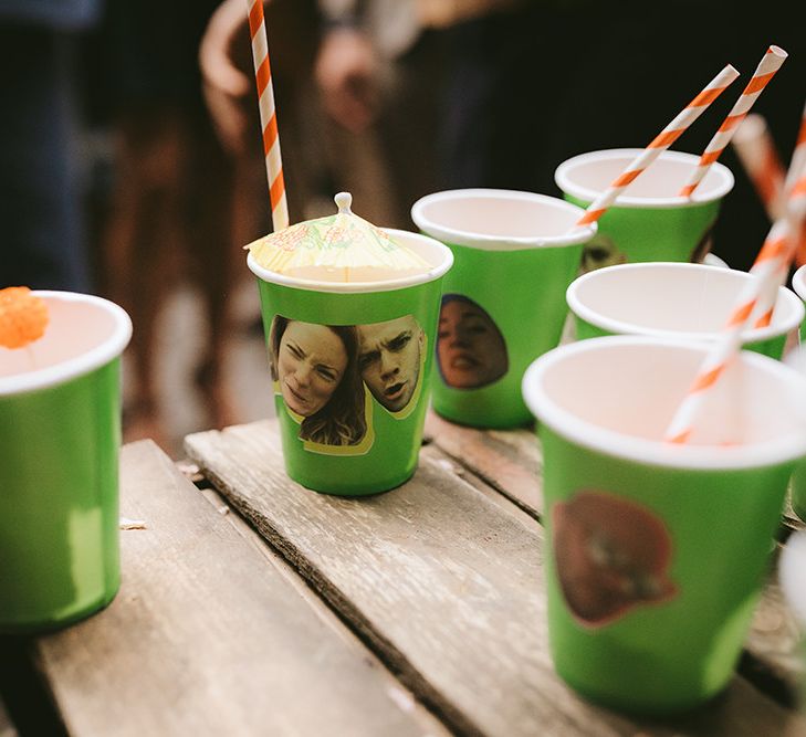 Tequila Cocktails Served in Green Cups with Photos of Bride and Groom on Side | Bike Shed Motorcycle Club Wedding for ELLE Digital Editor | Nigel John Photography