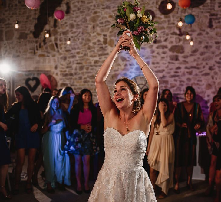 Bouquet Toss | Bride in Ellis Bridal Tulle &amp; Embroidery Bridal Gown | Colourful Chinese Lanterns at Domaine St Germain Wedding Venue, South of France | Andy Gaines Photography | Thompson Granger Films