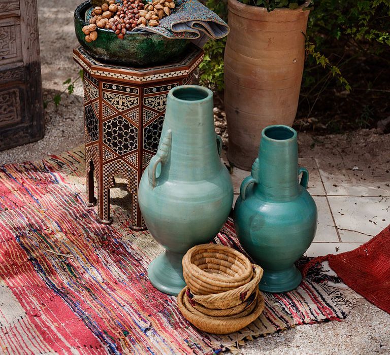 Ceramic Pots | Wooden Door Altar | Moroccan Rugs | Outdoor Ceremony Wedding Decor | Paradise Destination Wedding at Jnane Tamsna in Marrakech, Morocco | Nordica Photography | Matteo Castelluccia Film