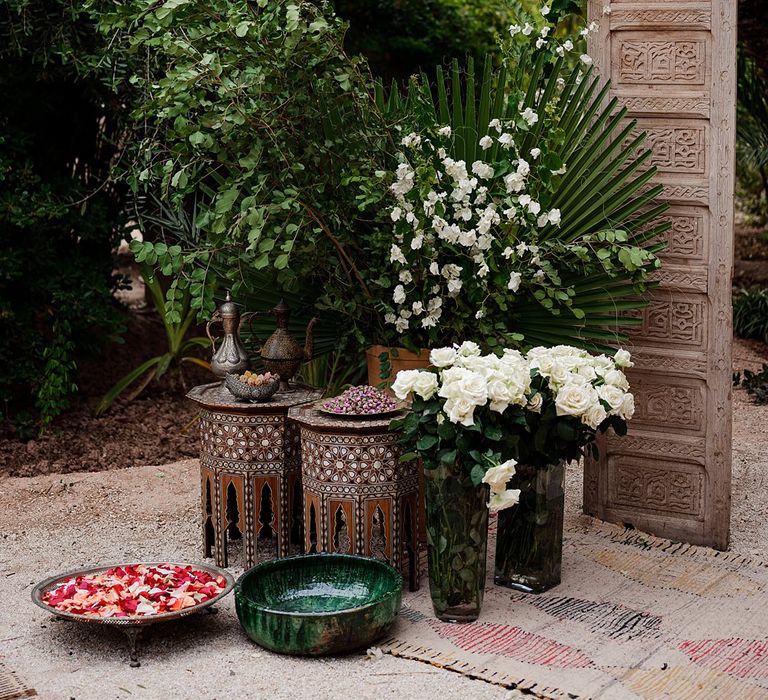 Ceramic Pots | Wooden Door Altar | Moroccan Rugs | Outdoor Ceremony Wedding Decor | Paradise Destination Wedding at Jnane Tamsna in Marrakech, Morocco | Nordica Photography | Matteo Castelluccia Film