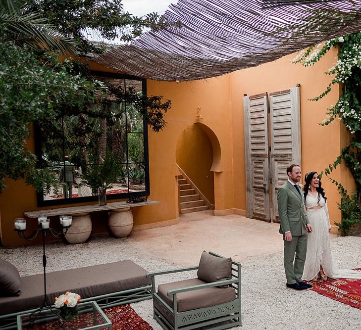 Bride in rue de Seine Bridal Gown | Groom in Green Beggars Run Suit | Paradise Destination Wedding at Jnane Tamsna in Marrakech, Morocco | Nordica Photography | Matteo Castelluccia Film