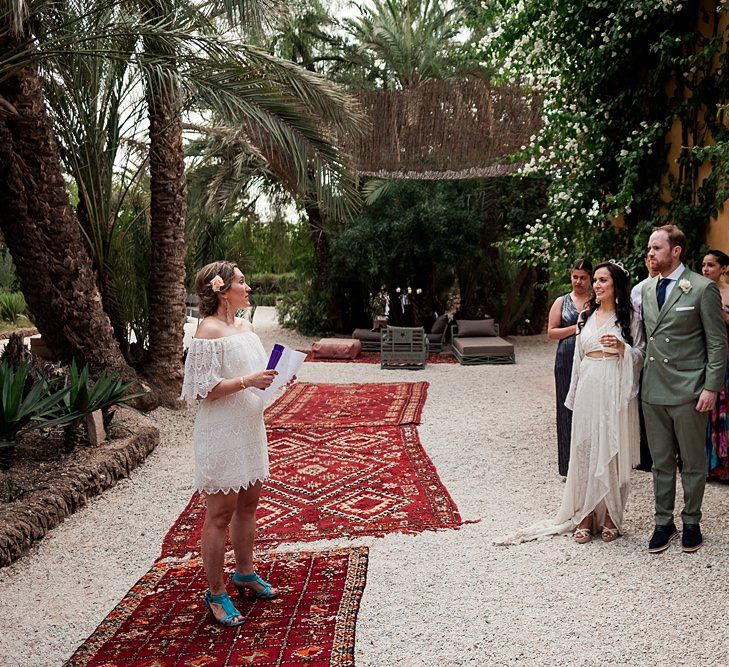 Bride in rue de Seine Bridal Gown | Groom in Green Beggars Run Suit | Paradise Destination Wedding at Jnane Tamsna in Marrakech, Morocco | Nordica Photography | Matteo Castelluccia Film