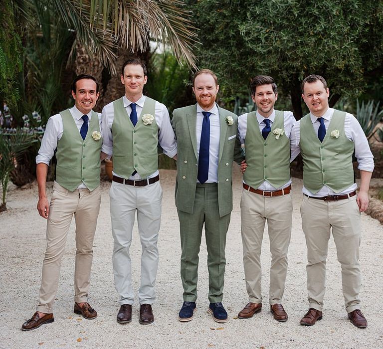 Groomsmen in Green Beggars Run Suits | Paradise Destination Wedding at Jnane Tamsna in Marrakech, Morocco | Nordica Photography | Matteo Castelluccia Film