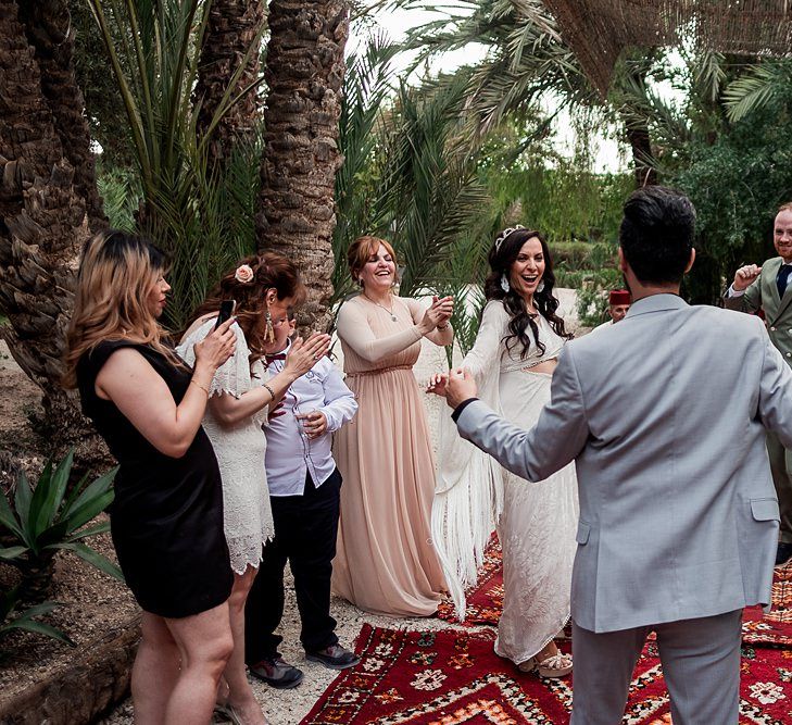 Bride in rue de Seine Bridal Gown | Groom in Green Beggars Run Suit | Paradise Destination Wedding at Jnane Tamsna in Marrakech, Morocco | Nordica Photography | Matteo Castelluccia Film