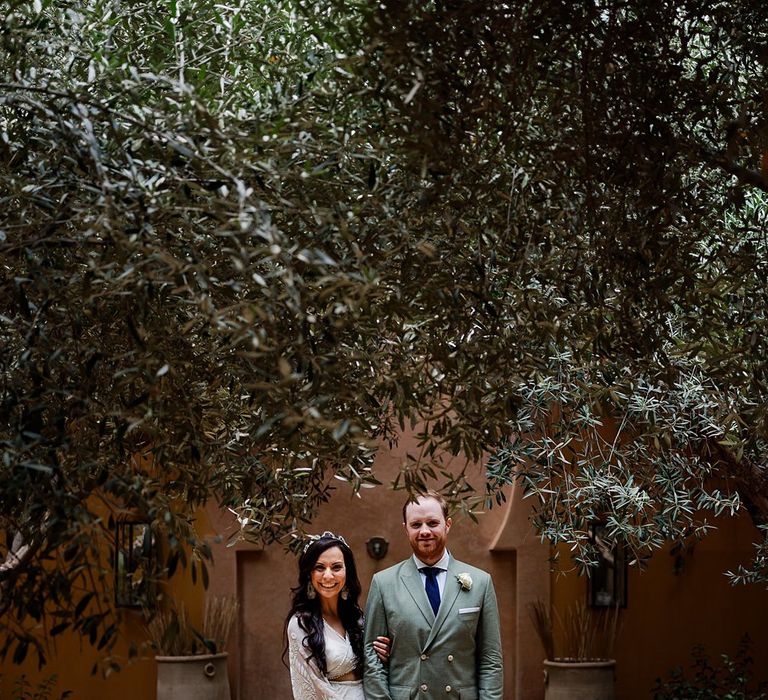 Bride in rue de Seine Bridal Gown | Groom in Green Beggars Run Suit | Paradise Destination Wedding at Jnane Tamsna in Marrakech, Morocco | Nordica Photography | Matteo Castelluccia Film