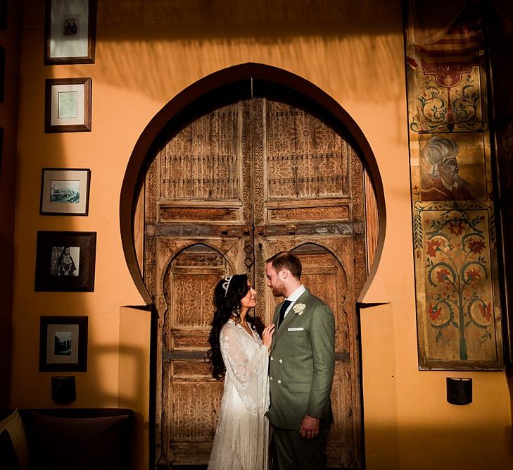 Bride in rue de Seine Bridal Gown | Groom in Green Beggars Run Suit | Paradise Destination Wedding at Jnane Tamsna in Marrakech, Morocco | Nordica Photography | Matteo Castelluccia Film