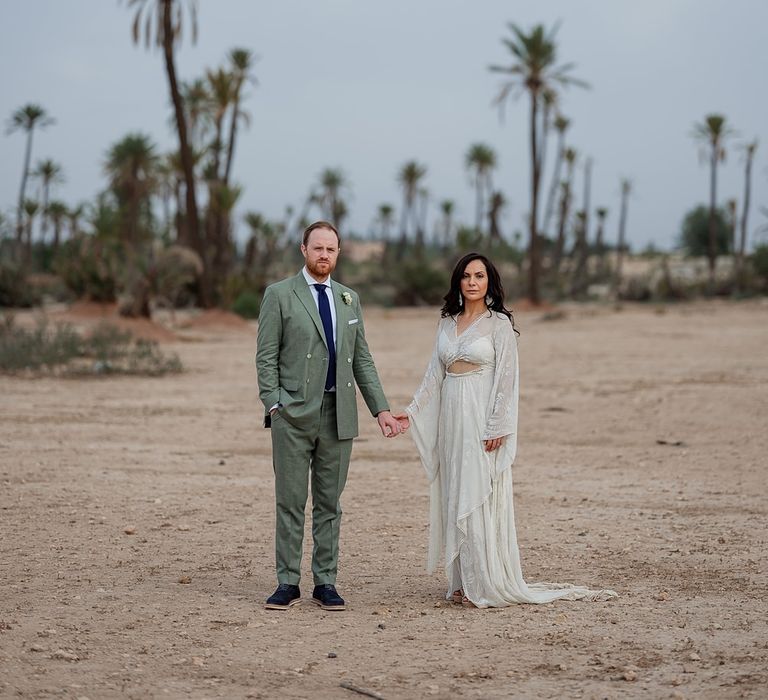 Bride in rue de Seine Bridal Gown | Groom in Green Beggars Run Suit | Paradise Destination Wedding at Jnane Tamsna in Marrakech, Morocco | Nordica Photography | Matteo Castelluccia Film