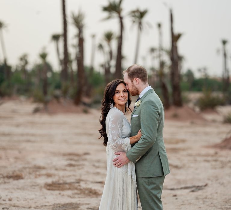 Bride in Rue de Seine Bridal Gown | Groom in Green Beggars Run Suit | Paradise Destination Wedding at Jnane Tamsna in Marrakech, Morocco | Nordica Photography | Matteo Castelluccia Film