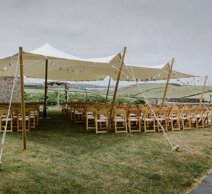 stretch tent wedding ceremony setup at Roscarrock Farm in Cornwall