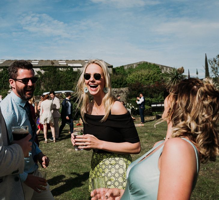 Wedding guests laughing at stretch tent wedding