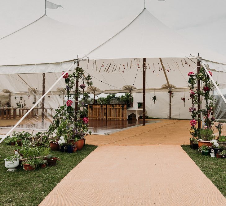 stretch tent ceremony and marquee reception with rustic DIY decor