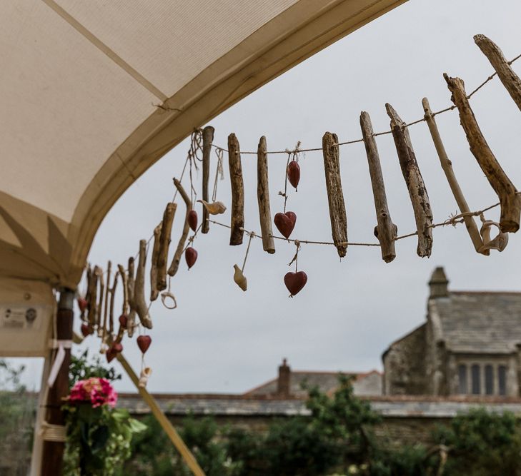 DIY coastal wedding decor with drift wood and shells