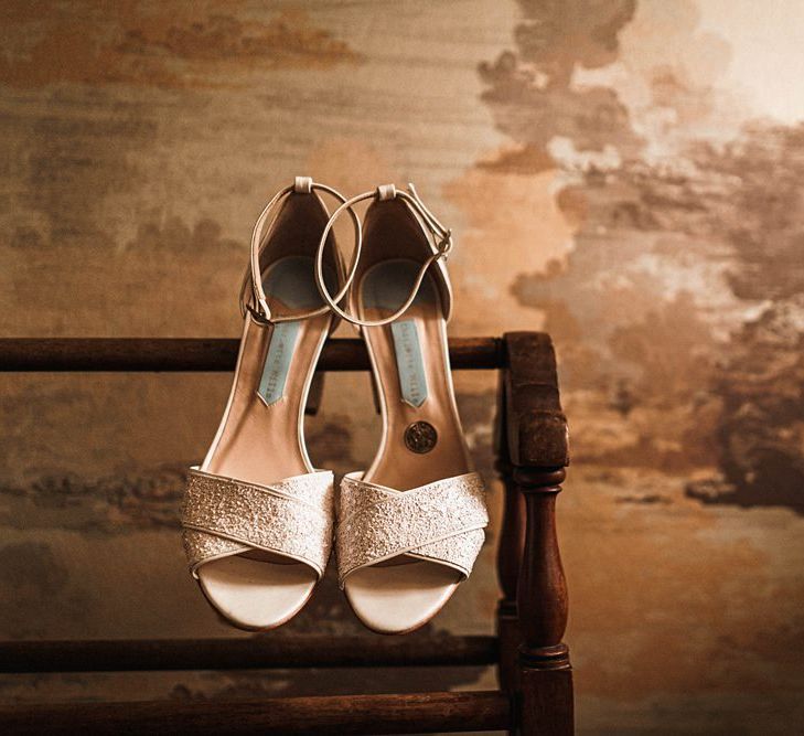 Bridal shoe detail at sophisticated autumn celebration