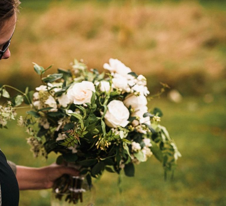 Beautiful white flower bouquet for sophisticated outdoor ceremony