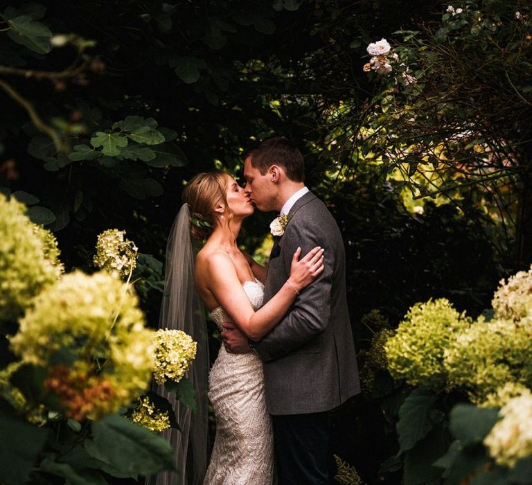 Bride and groom steal a moment at outdoor celebration in autumn