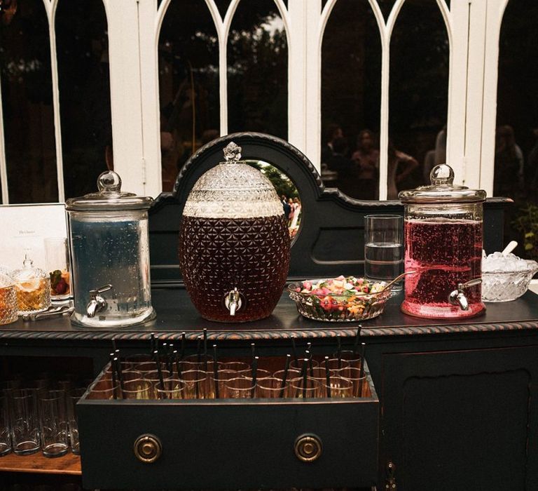 Reception drinks station with drinks dispensers and fruit to personalise