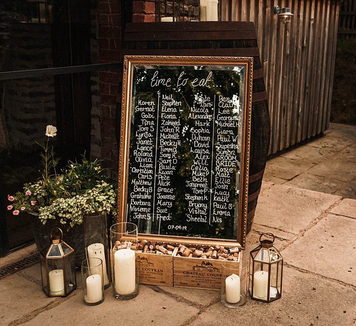 Mirror table plan with lantern candles at sophisticated autumn celebration