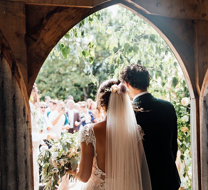 Bride in Antonia Berta Muse Wedding Dress | Groom in Navy Suit | Rustic Greenery Wedding at Cripps Barn Cotswolds | Wedding_M Photography