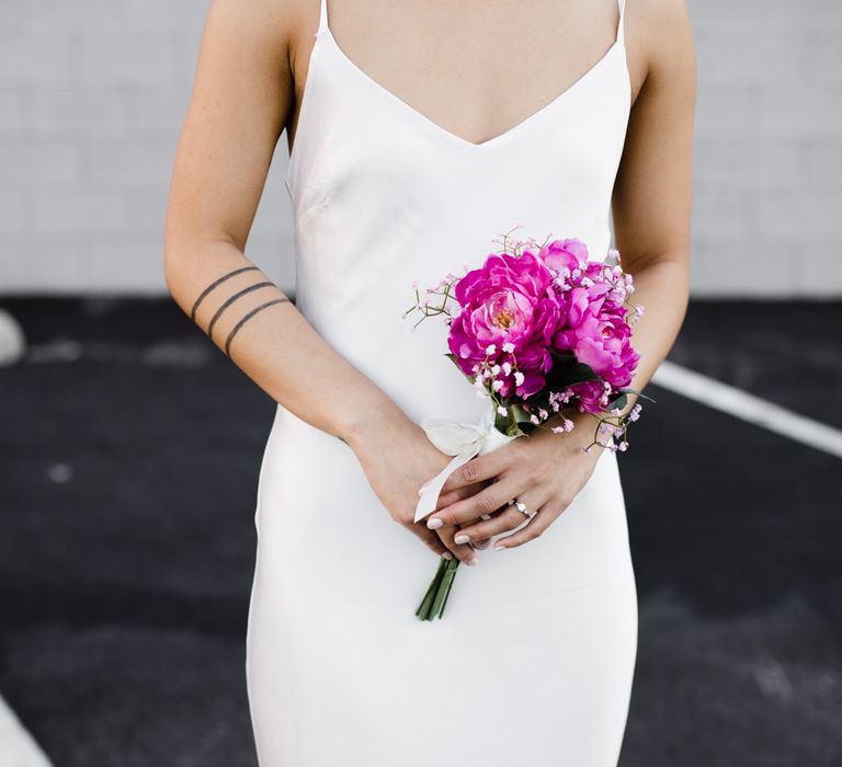 Bride in Silk BHLDN Dress with Spaghetti Straps and V-Back | Fuschia Sweet Pea Spray Silk Flowers Bouquet | Las Vegas Wedding with Gold Sequin Bridesmaids Dresses and Silk Flowers | Chris Barber Photography