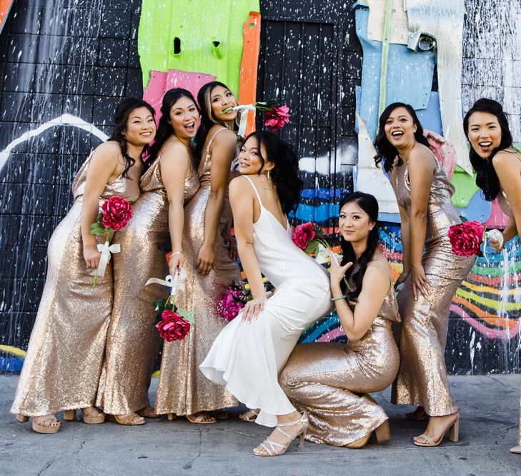 Bride in Silk BHLDN Dress with Spaghetti Straps and V-Back | Bridesmaids in Gold Sequin Maxi Dresses with Cowl Back | Fuschia Sweet Pea Spray Silk Flowers | Las Vegas Wedding with Gold Sequin Bridesmaids Dresses and Silk Flowers | Chris Barber Photography