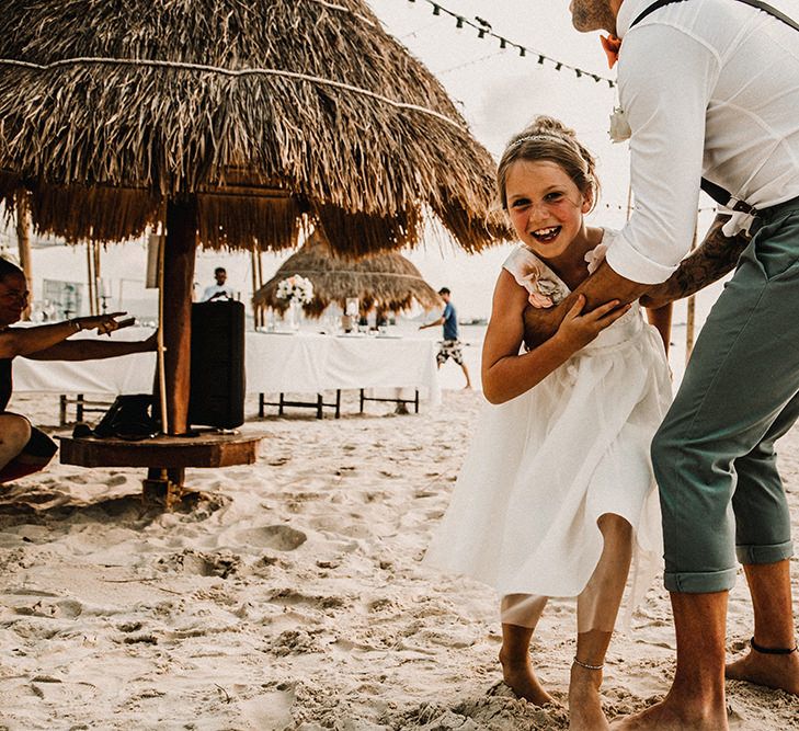 Flower Girl &amp; Groom | Bride in Grace Loves Lace Gia Gown | Groom in Turned Up Trousers, Bow Tie &amp; Braces from Topman | Tropical Destination on the Beach at Nice Sea Resort, Koh Phangan Thailand Planned by Phangan Weddings | Carla Blain Photography