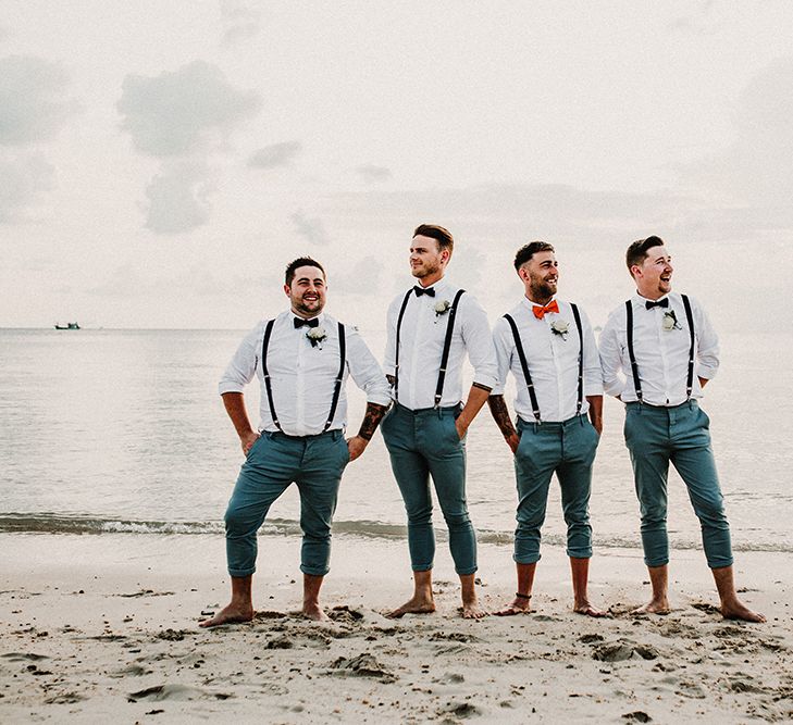 Groomsmen in Turned Up Trousers, Bow Ties &amp; Braces from Topman | Tropical Destination on the Beach at Nice Sea Resort, Koh Phangan Thailand Planned by Phangan Weddings | Carla Blain Photography