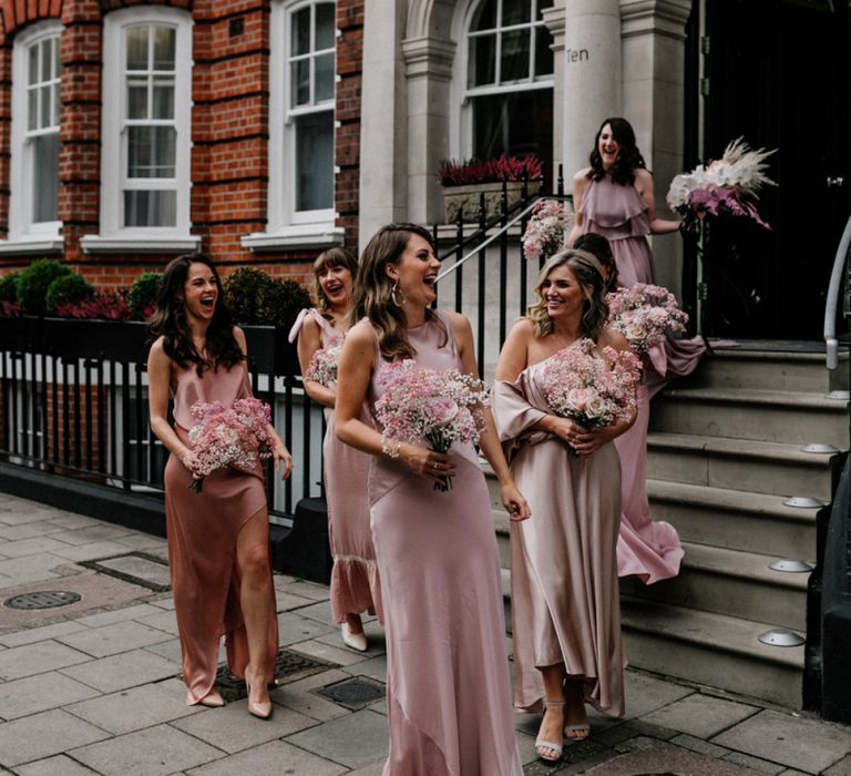 Bridesmaids in Different Pink Dresses with Pink Gypsophila Bouquets